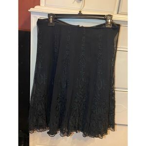 Super cute black lace skirt! No tags but fits like a medium